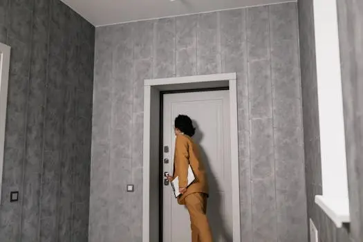 Photo of a property manager or landlord attempting to gain entry into a home.